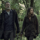 Negan and Maggie walk in a forest in The Walking Dead.